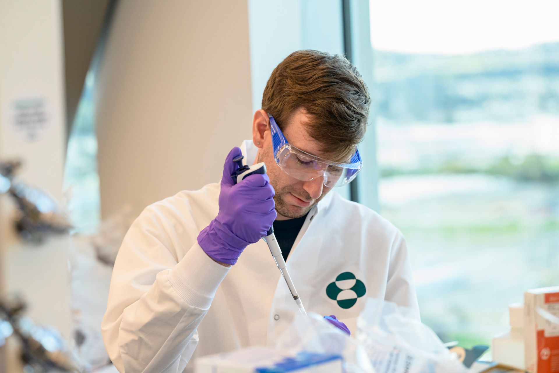 Focused scientist with pipette