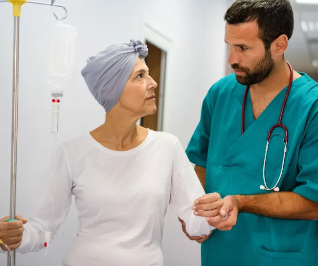 a nurse helping a patient