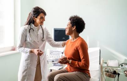 Physician speaking with female patient